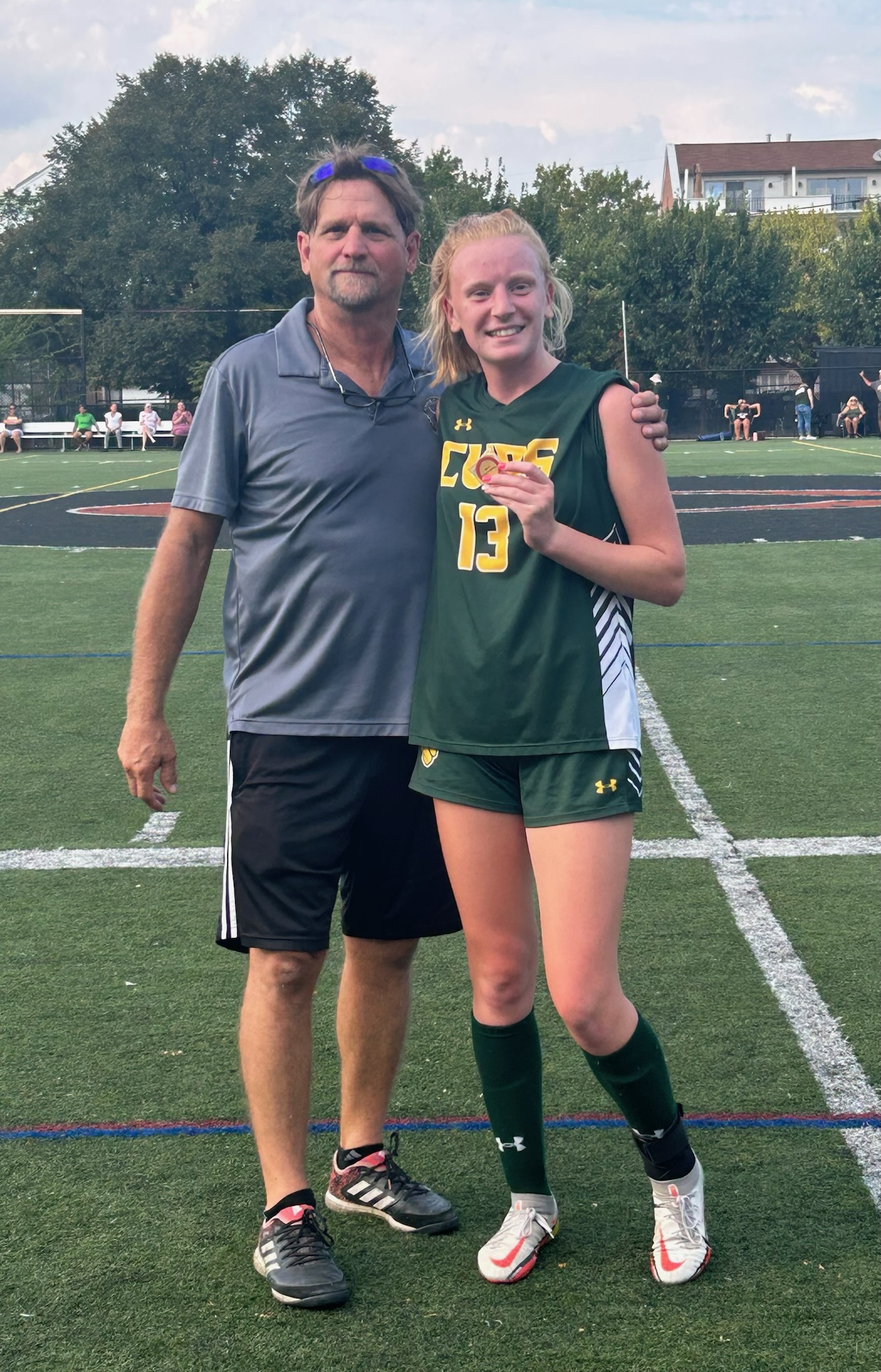 SJCP Head Soccer Coach Presents Character Coin to Jenna Kenner, The Catholic High School Soccer